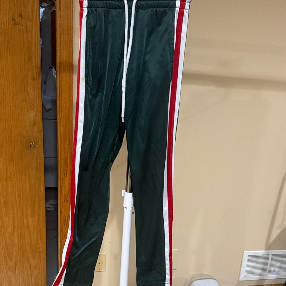 Green Track Pants with Red and White Stripes